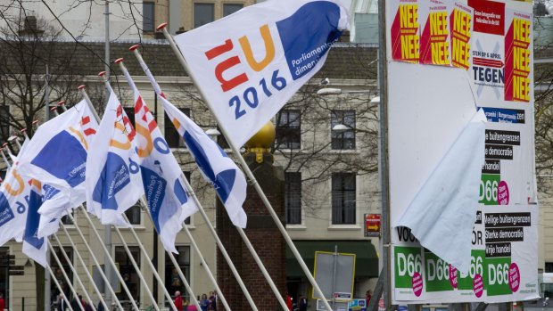 Flags of the Dutch EU presidency and campaign posters for the referendum on the EU-Ukraine agreement in The Hague on Wednesday. 