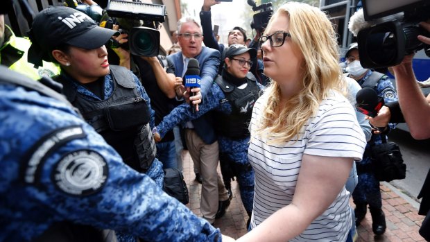 Australian Cassandra "Cassie" Sainsbury, is escorted by police to her sentencing hearing in Bogota, Colombia, on Wednesday.