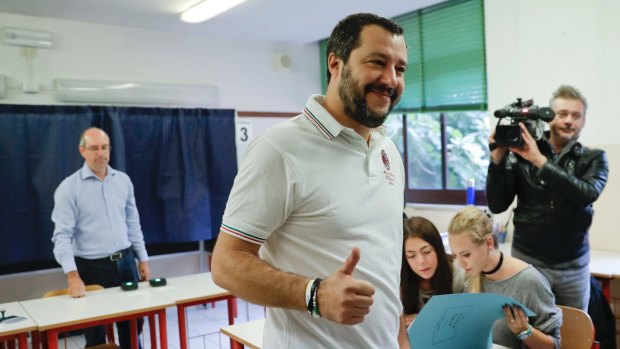 Leader of the Northern League party, Matteo Salvini, gives thumbs up after casting his ballot in Milan on Sunday.