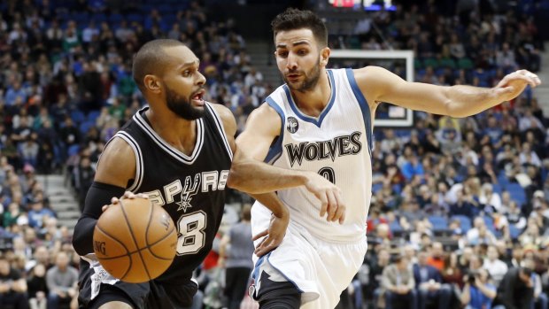 On the charge: Spurs guard Patty Mills. 