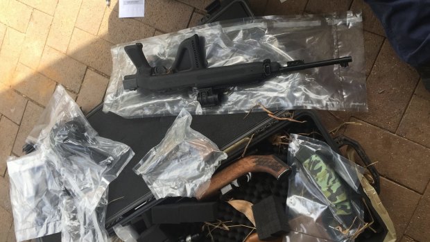 Queensland Police Taskforce Maxima officers and Border Force seized weapons during a raid at Clear Mountain, Queensland.