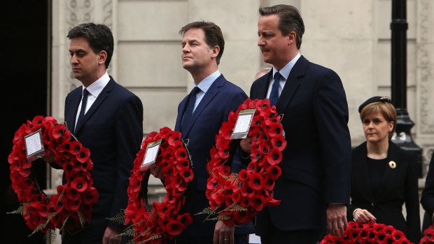 Britain's Ed Miliband, Nick Clegg and Prime Minister David Cameron walk past SNP leader Nicola Sturgeon to place a wreath during a tribute at the Cenotaph.