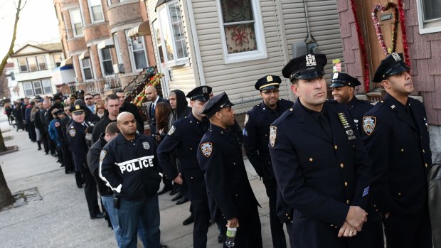 Police officers line up for the wake for NYPD officer Rafael Ramos.