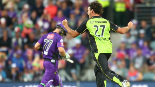 Off he goes: Clint McKay dismisses Hobart's Tim Paine.