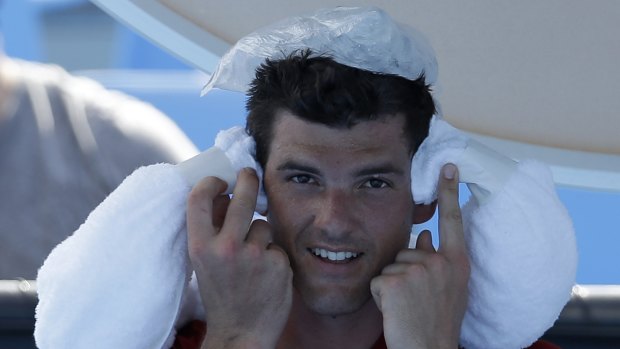 Canadian Frank Dancevic applies an ice pack after collapsing during his first round match in the 2014 Australian Open.