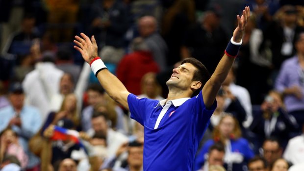 Victory: Novak Djokovic celebrates after defeating Roger Federer to win the 2015 US Open in New York.