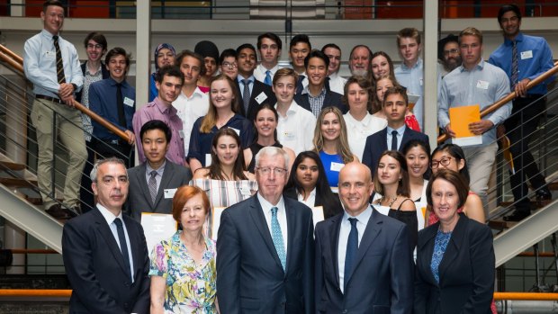NSW ministers Adrian Piccoli and Leslie Williams, at right, with school students who topped an HSC subject.