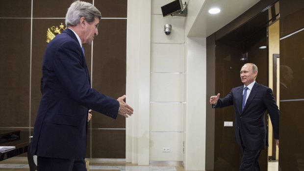 Icebreaker ... US Secretary of State John Kerry (left) reaches out to shake hands with Russia's President Vladimir Putin at the presidential residence Bocharov Ruchey in Sochi.