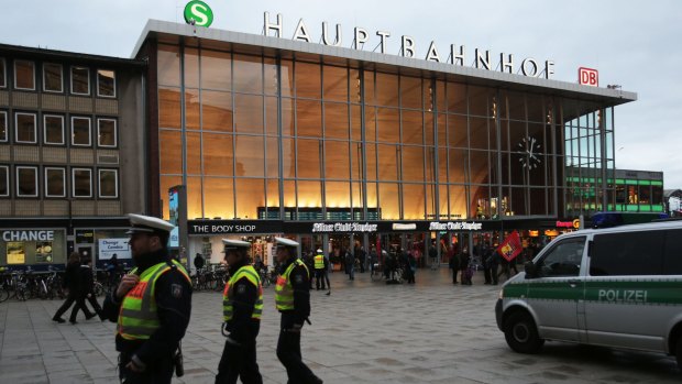 German police patrol in front of the central railway station in Cologne, where retaliatory attacks on immigrants have been reported.