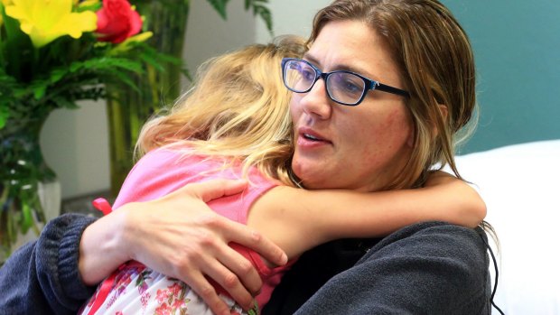 Tracy Anderwald hugs her daughter Allisonat Christus Spohn Hospital Memorial in Corpus Christi, Texas.