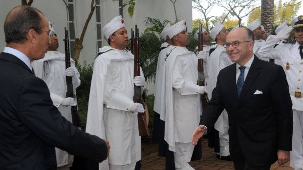 French Interior Minister Bernard Cazeneuve (right) shakes hands with his Moroccan counterpart Mohamed Hassad  in Rabat on Saturday. 