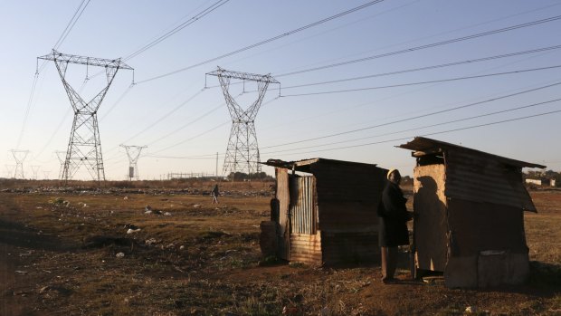 Power lines cross an informal settlement on the outskirts of Sebokeng, south of Johannesburg, last year. 