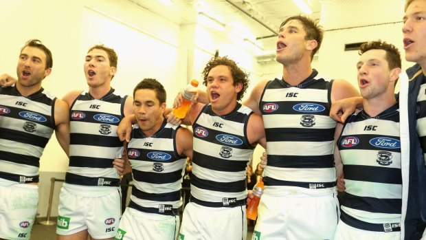 Geelong players sing the club song in the rooms after defeating Port Adelaide on Friday.