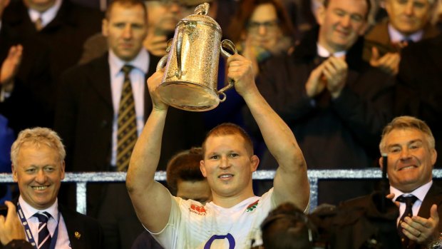 Silverware: England captain Dylan Hartley lifts the Calcutta Cup.