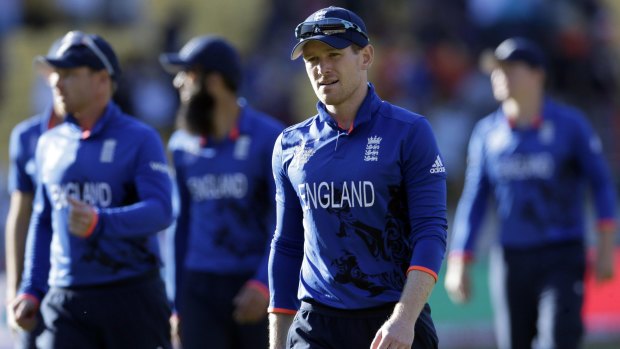Fiasco: England captain Eoin Morgan leads his team off the field after they were annihilated by New Zealand.
