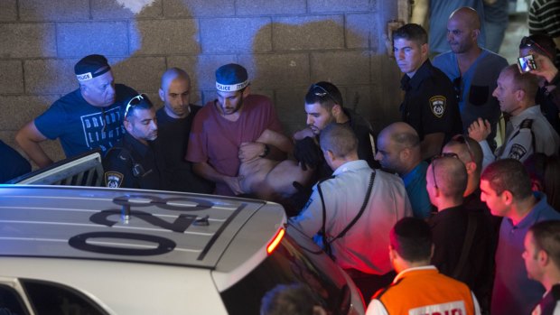 Israeli police arrest a Palestinian identified as Raed Khalil bin Mahmoud, a 36-year-old from the West Bank village of Dura in Tel Aviv. Bin Mahmoud fatally stabbed two Israeli men, police said. 