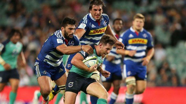 Bernard Foley is tackled during the match against the Stormers. He is likely to face an even more searching examination against the Hurricanes.