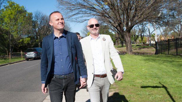 Chief Minister Andrew Barr votes at Ainslie North Primary School with partner Anthony Toms. 