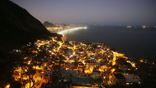 Lights shine in the Vidigal favela community overlooking Ipanema beach. A weekly survey of 100 central-bank economists found predictions of Brazil's economic performance worsened for this year and 2016.