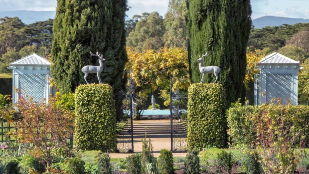 Bronze stags from Rome sit atop concrete pillars.