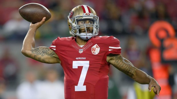 Protest: San Francisco 49ers quarterback Colin Kaepernick did not stand for the US national anthem.