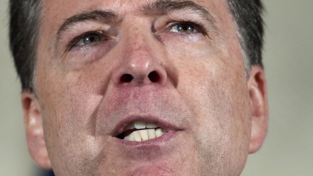 No charges: FBI director James Comey makes his statement at FBI Headquarters in Washington on Tuesday.