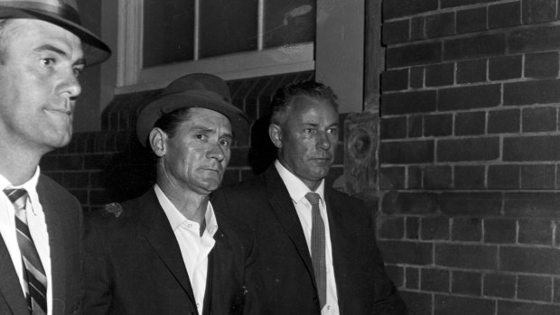 Melbourne prison escapee Ronald Ryan is taken to police headquarters in Sydney after his recapture, 5 January 1966.