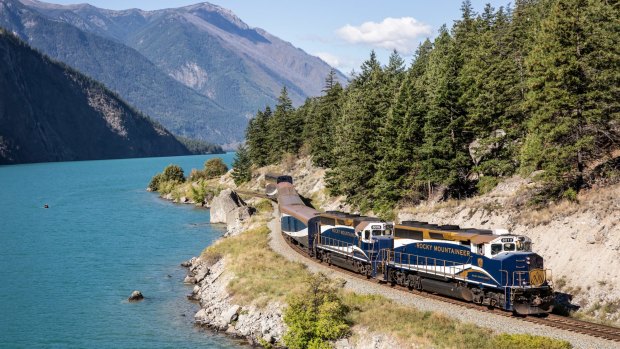 The Rocky Mountaineer train passes beside Seton Lake along the Rainforest to Goldrush route.
