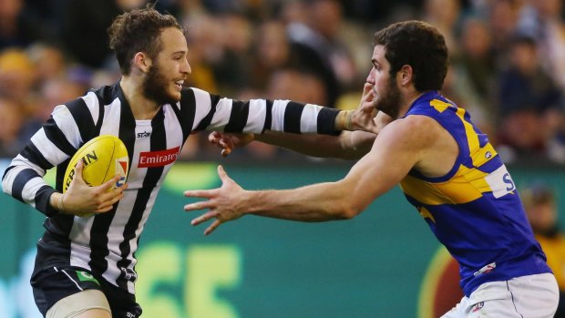 Magpie James Aish fends off Jack Darling.