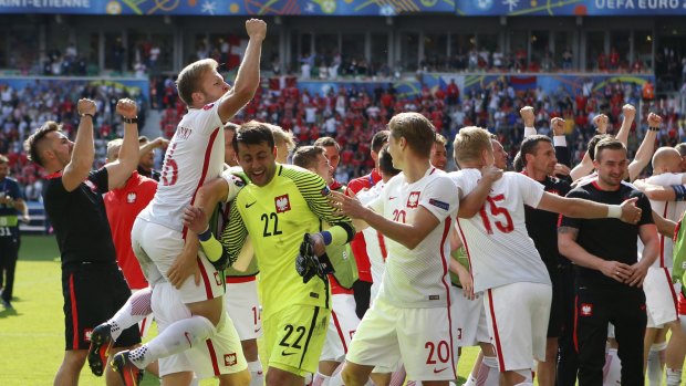 Jubilation: Poland's players celebrate at the end of the Euro 2016 round of 16 match against Switzerland.