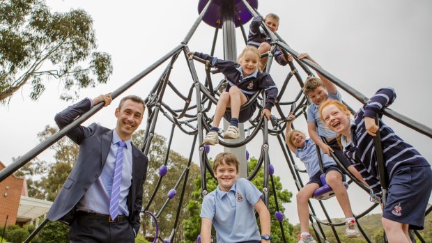 Principal Justin Garrick, pictured with year 2 students, announced on Tuesday that Canberra Grammar will become co-educational.