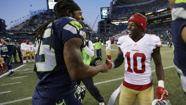 Friendly rivals: Seattle cornerback Richard Sherman greets San Francisco wide receiver Bruce Ellington after the Seahawks defeated the 49ers 29-13 in Seattle.