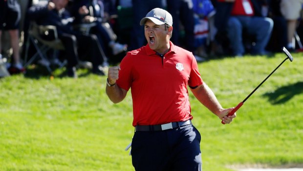 On a roll: Patrick Reed of the United States celebrates a putt on the 16th.
