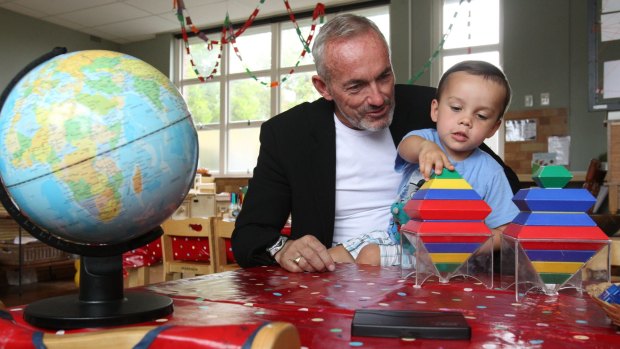 Brendan McAssey, with his three-year-old son Stirling, opposes means testing of the childcare rebate. 