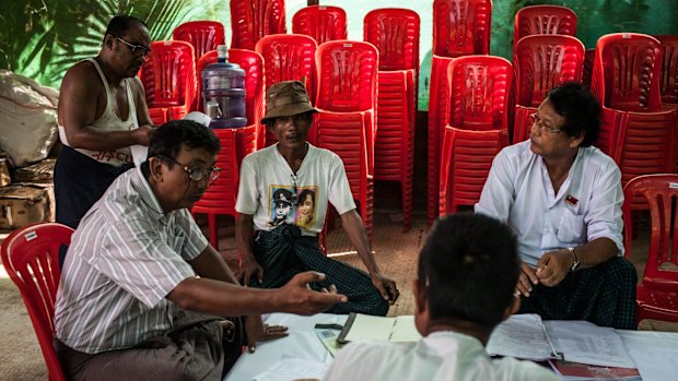 Volunteers and officials meeting at the National League for Democracy Party's headquarters on Friday.