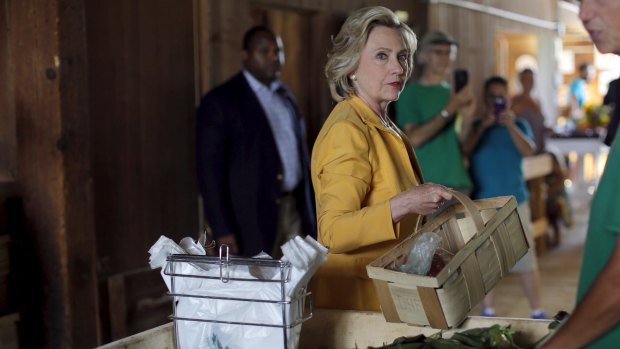 Hillary Clinton chooses fresh corn in New Hampshire last week. 