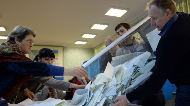 Couting ballots at a polling station in Kiev.