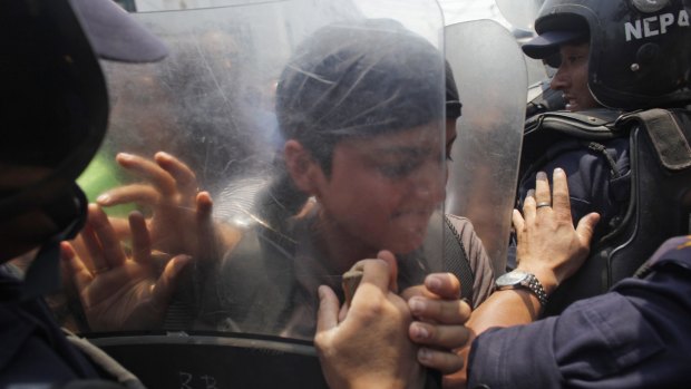 Protesters clash with police outside the prime minister's office on Sunday.