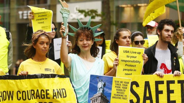 Australians attend a protests against US President Donald Trump's travel ban in Sydney.