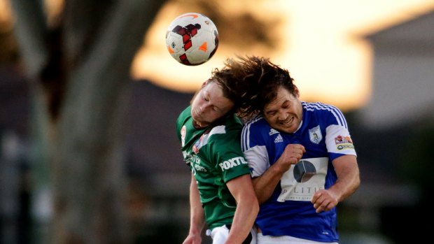 Headers under fire ... Australian youth players Benjamin Hay, left, and James Monie compete for a header. US Soccer is banning headers for children aged children aged 11 to 13 to cut down on concussions.