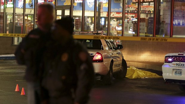 Police outside a Berkerley gas station after the shooting of a young black man.