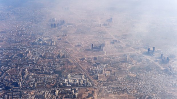 Smog envelops buildings on the outskirts of the Indian capital New Delhi last year.