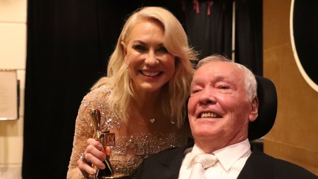 Kerri-Anne and John Kennerley pose with the Hall Of Fame Logie Award.