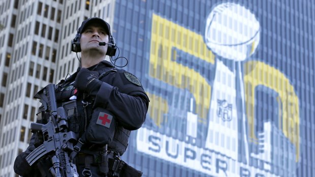 San Francisco Police tactical unit officer Jeff McHale watches the crowd at Super Bowl City in San Francisco in February. 