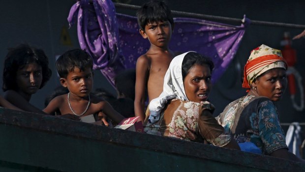 Migrants on a boat tethered to a Thai navy vessel in waters near Koh Lipe island on Friday.