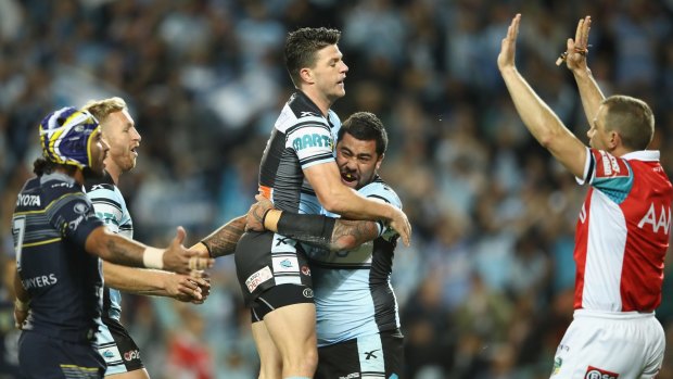 Eventful game: Chad Townsend celebrates with Andrew Fifita after the prop scored a try later disallowed.