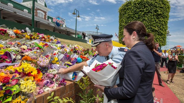 Queensland Premier Annastacia Palaszczuk and police assistant commissioner Brian Codd pay their respects at Dreamworld.