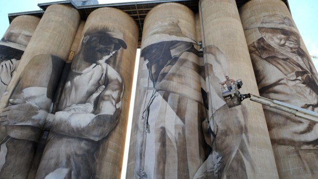 Van Helten places the finishing touches on his mural on silos in Brim in north-western Victoria.