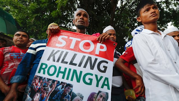 A Rohingya holds a banner during a protest after Friday prayers outside the Myanmar embassy in Kuala Lumpur, Malaysia, in November.