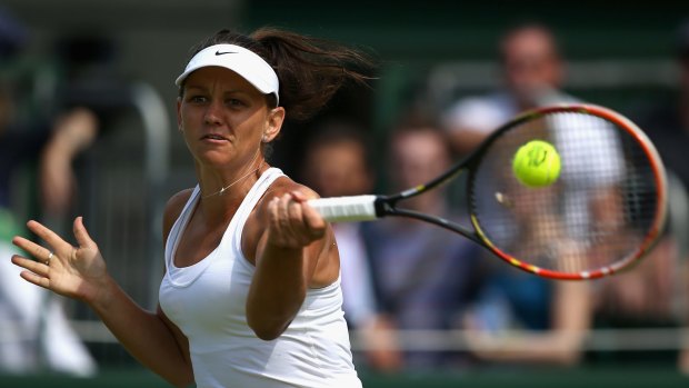 Casey Dellacqua belts a forehand on her way to beating Ukraine's Elina Svitolina in the second round of Wimbledon.